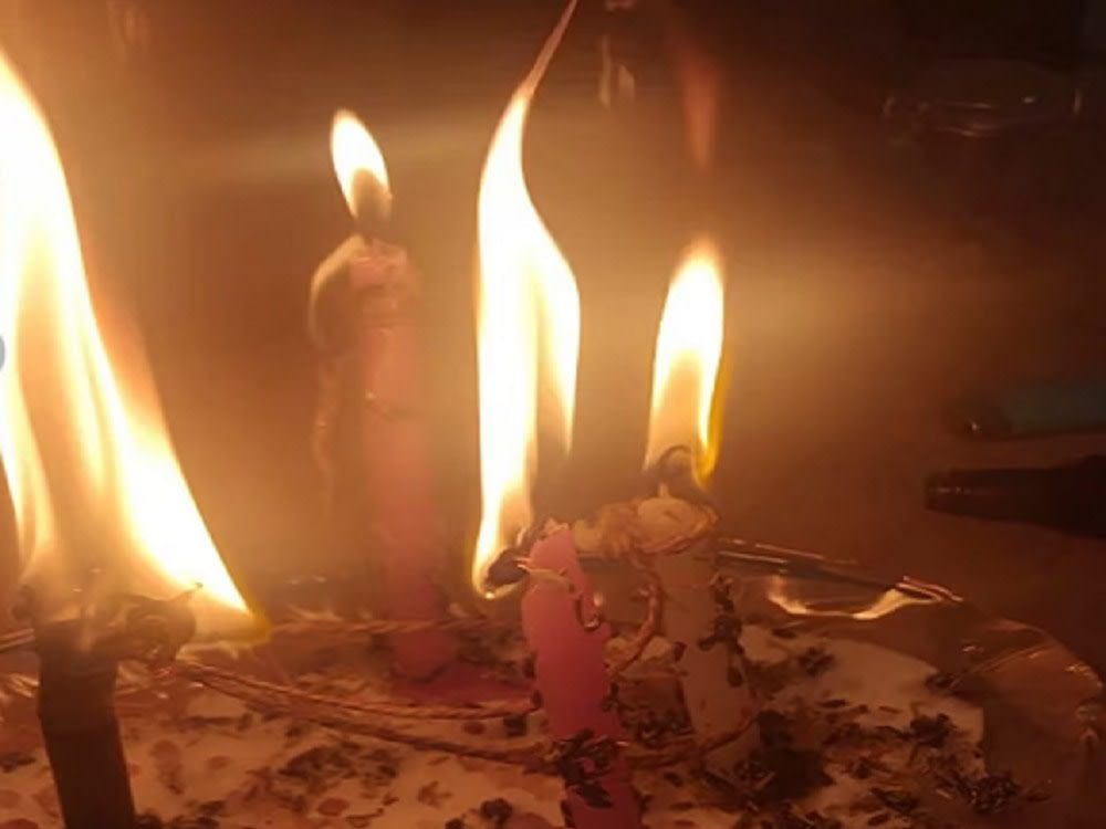 A practitioner preparing a powerful spell to bring back a lost love.