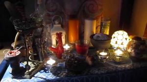 Active love spell ritual using romantic candles and personal items