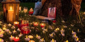 Romantic altar with red candles, herbs, and photos,,.