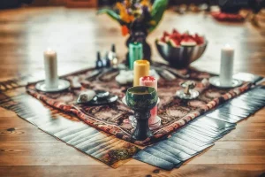 African rekindling love spell altar setup with sacred herbs and spiritual tools.