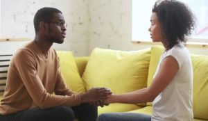 Couple reconnecting after using a powerful breakup prevention spell.