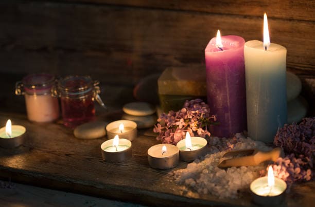 Spiritual tools and candles used by Prof Eric Galandi to select the correct love spell.