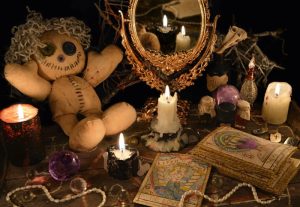 Prof. Eric Galandi in a professional spiritual setting with sacred Voodoo elements.
