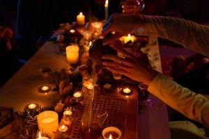 Prof. Eric Galandi performing Voodoo Return Lost Love Spell in mystical setting.
